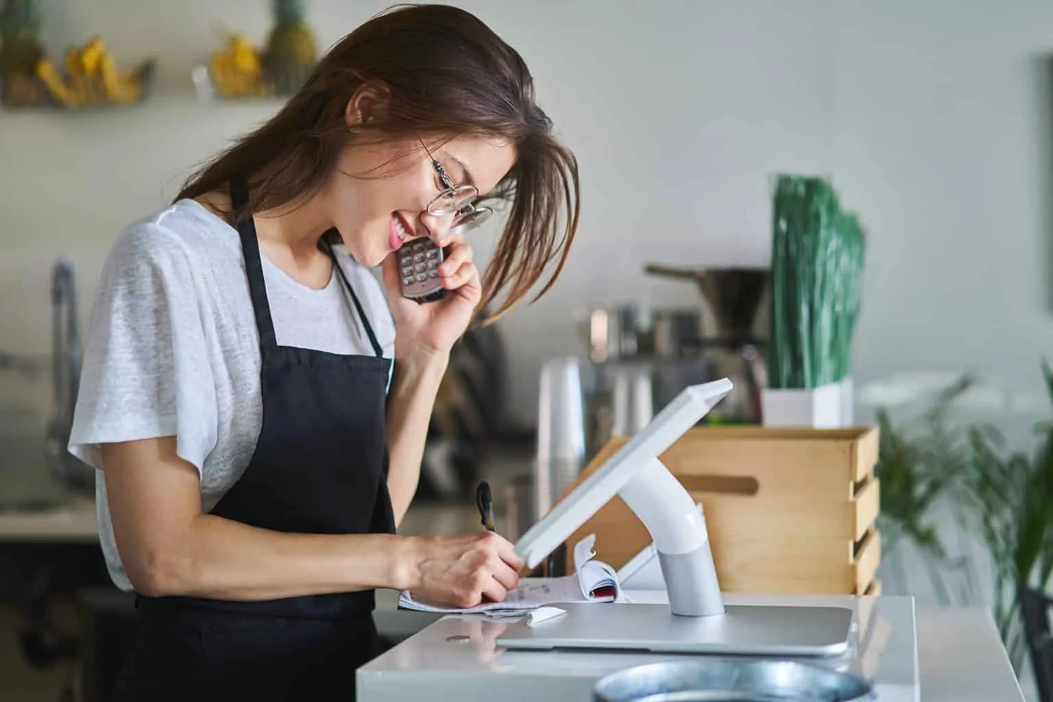 Restaurant staff member taking orders at the counter