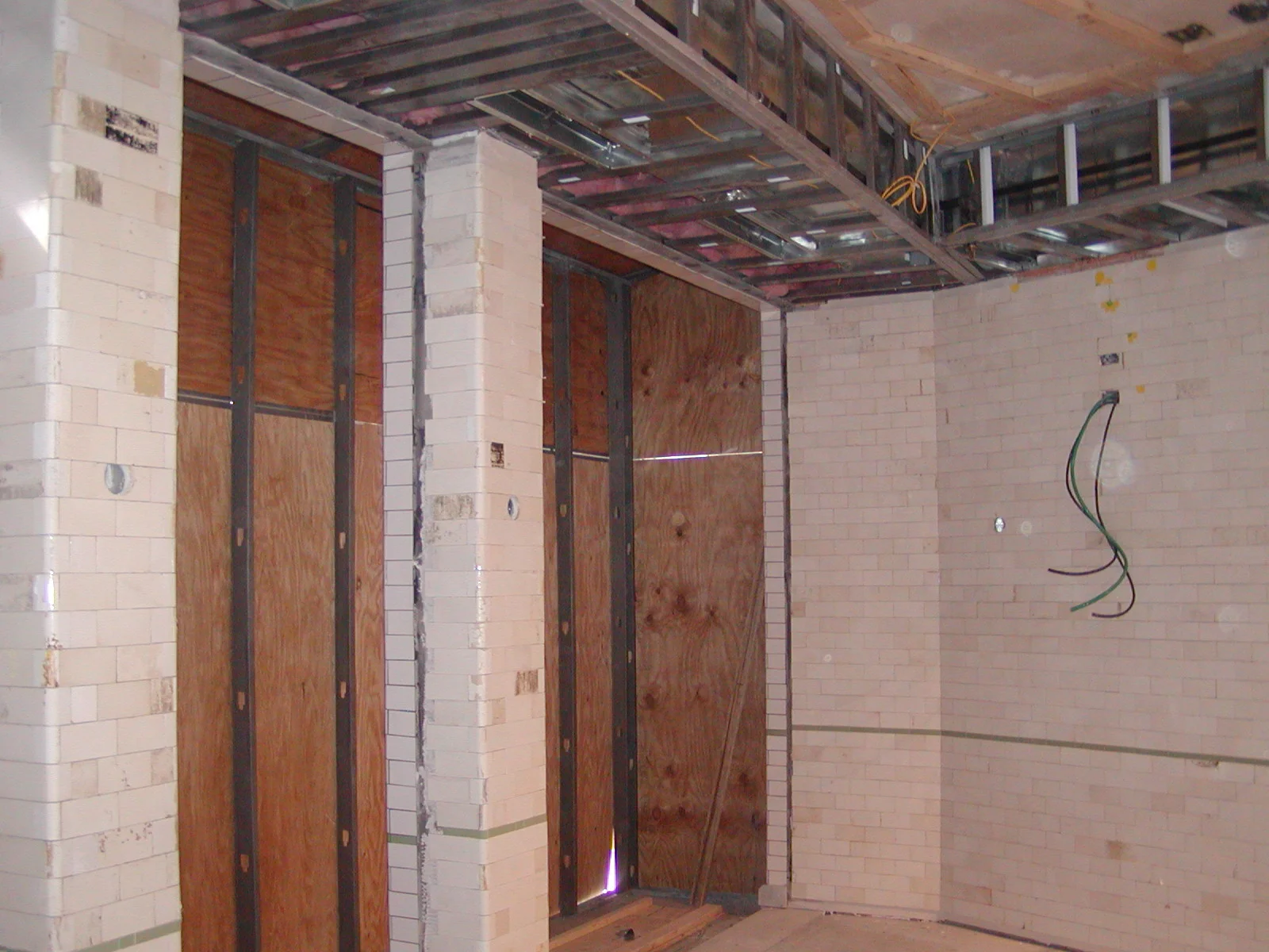 Under construction restaurant interior with exposed walls and framing