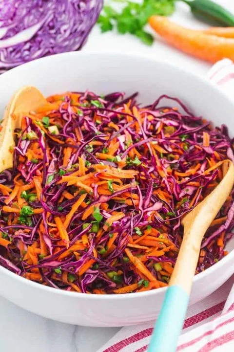 Colorful coleslaw salad with purple cabbage and carrots