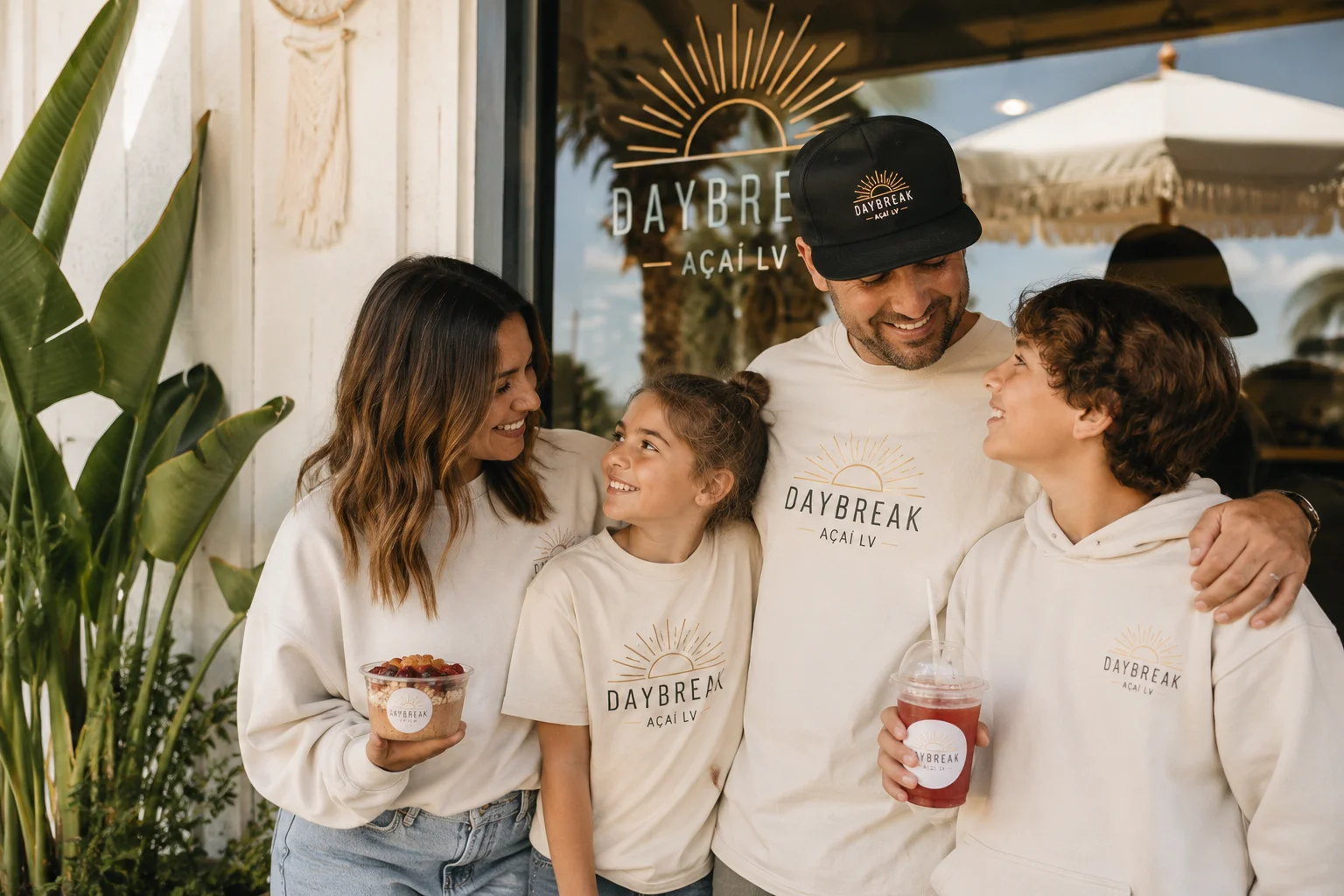 Family enjoying acai bowls outside Daybreak Açaí LV.