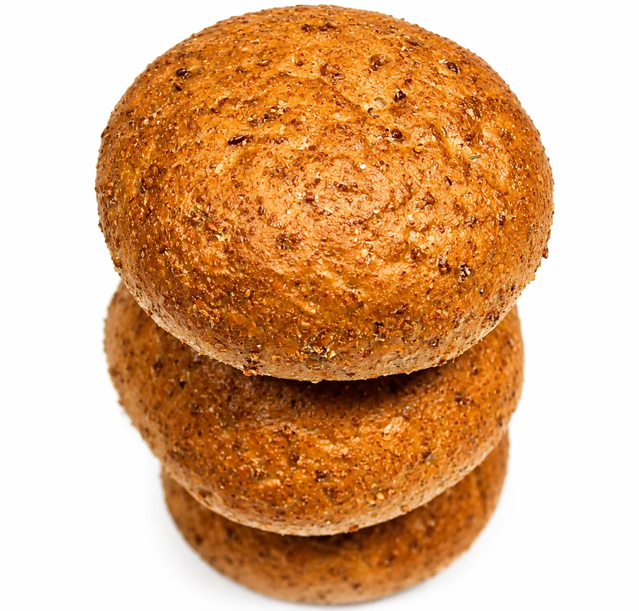 Three round whole grain bread rolls stacked on top of each other.