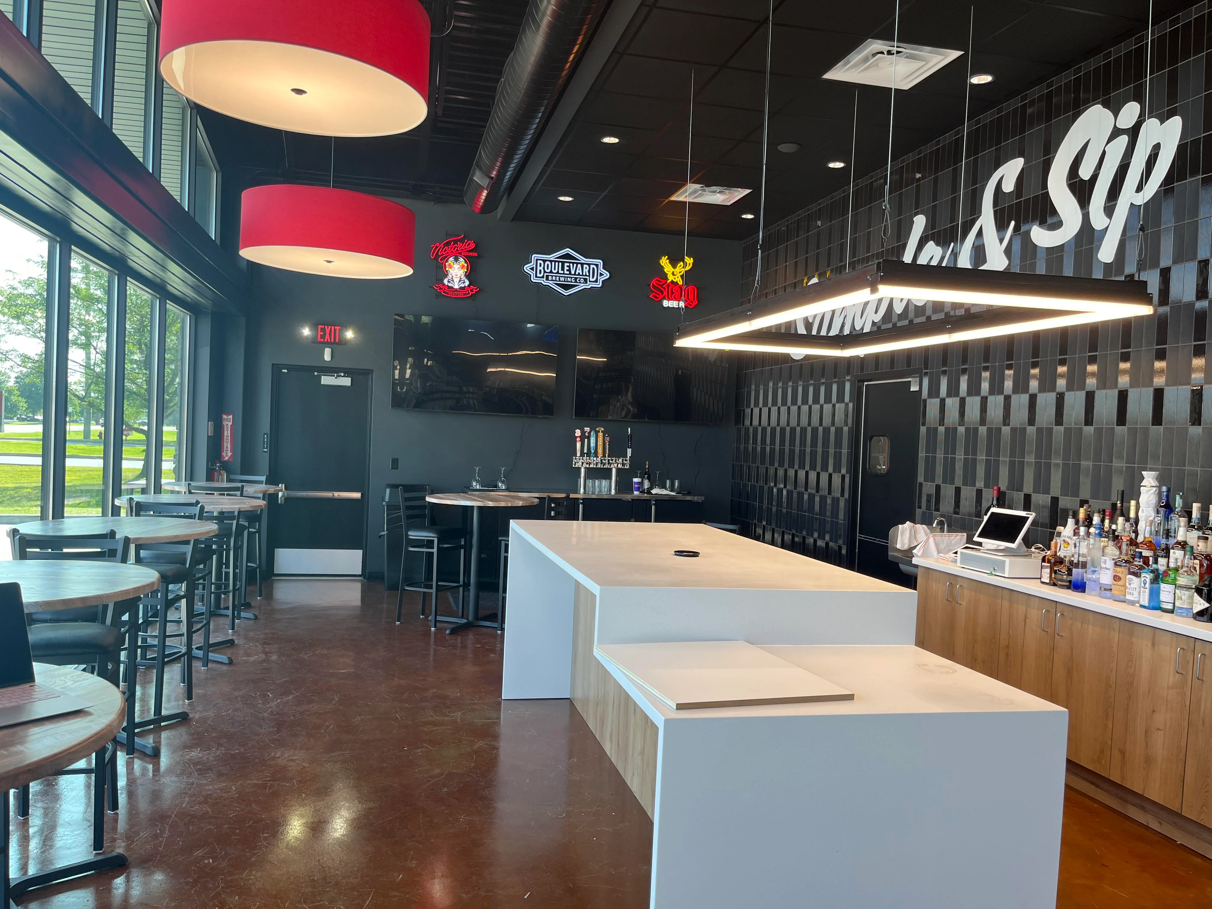 Modern bar interior with stylish lighting and seating