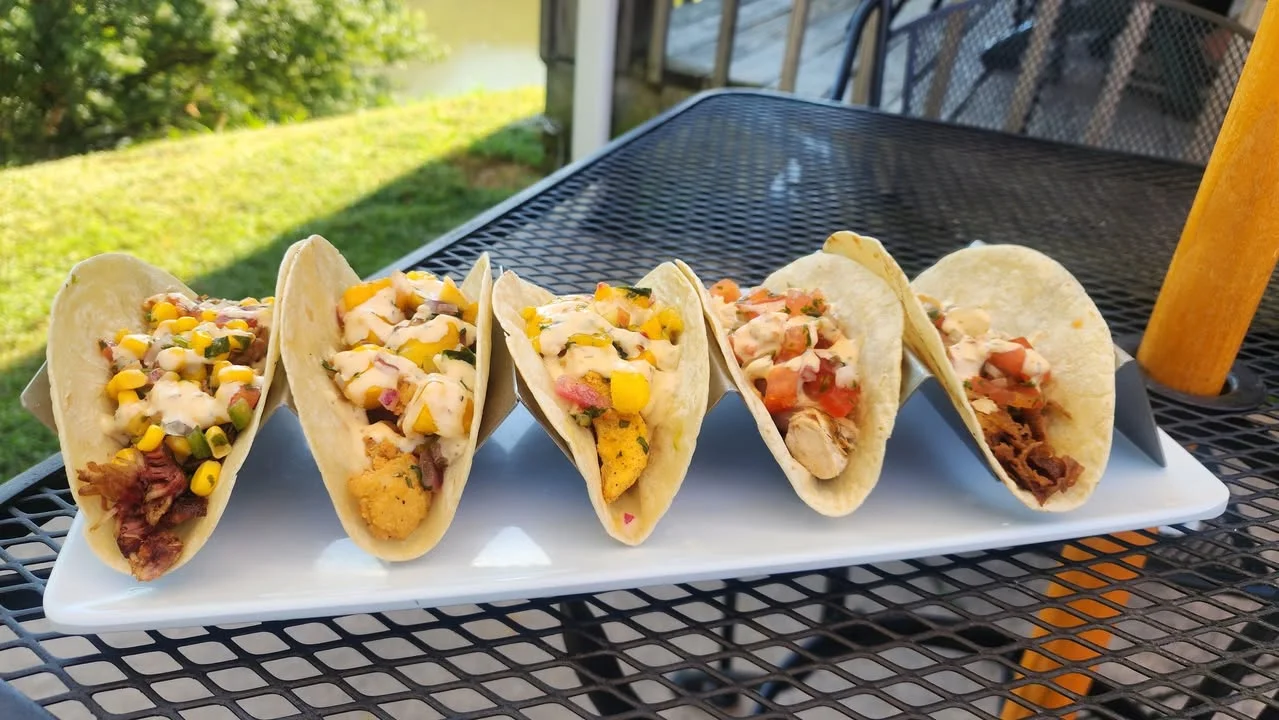 Assorted fish tacos served on a platter