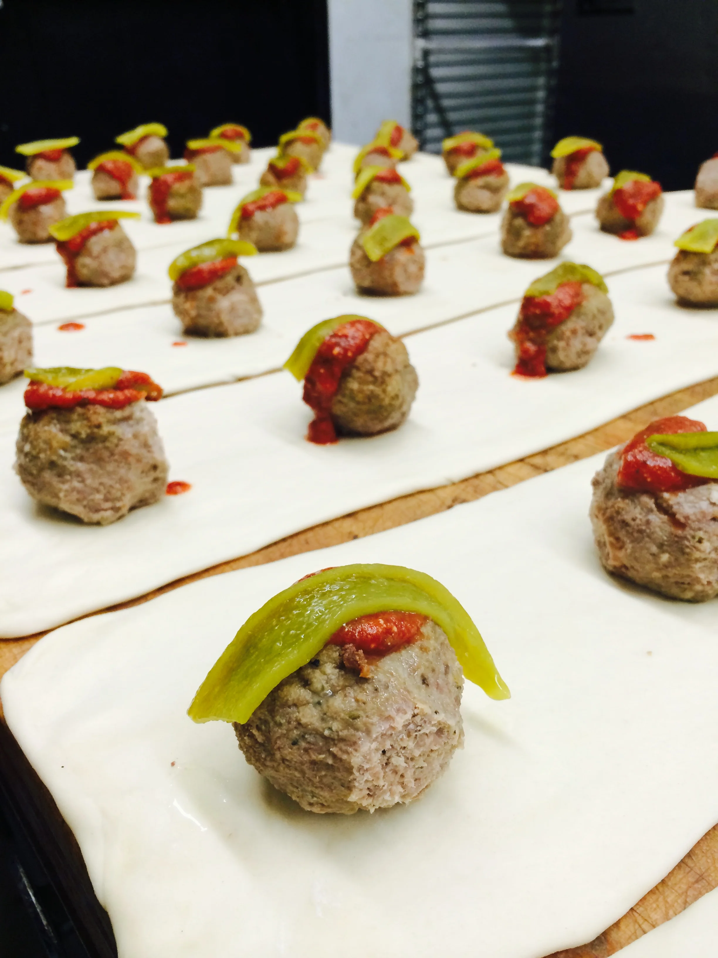 Italian meatball sliders on pastry dough