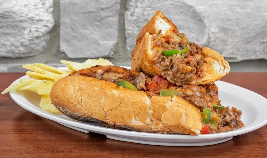 Delicious gourmet burger with fresh toppings on a wooden table