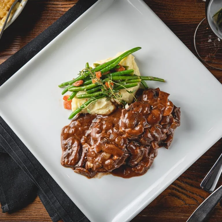 Classic beef stroganoff with mashed potatoes and green beans