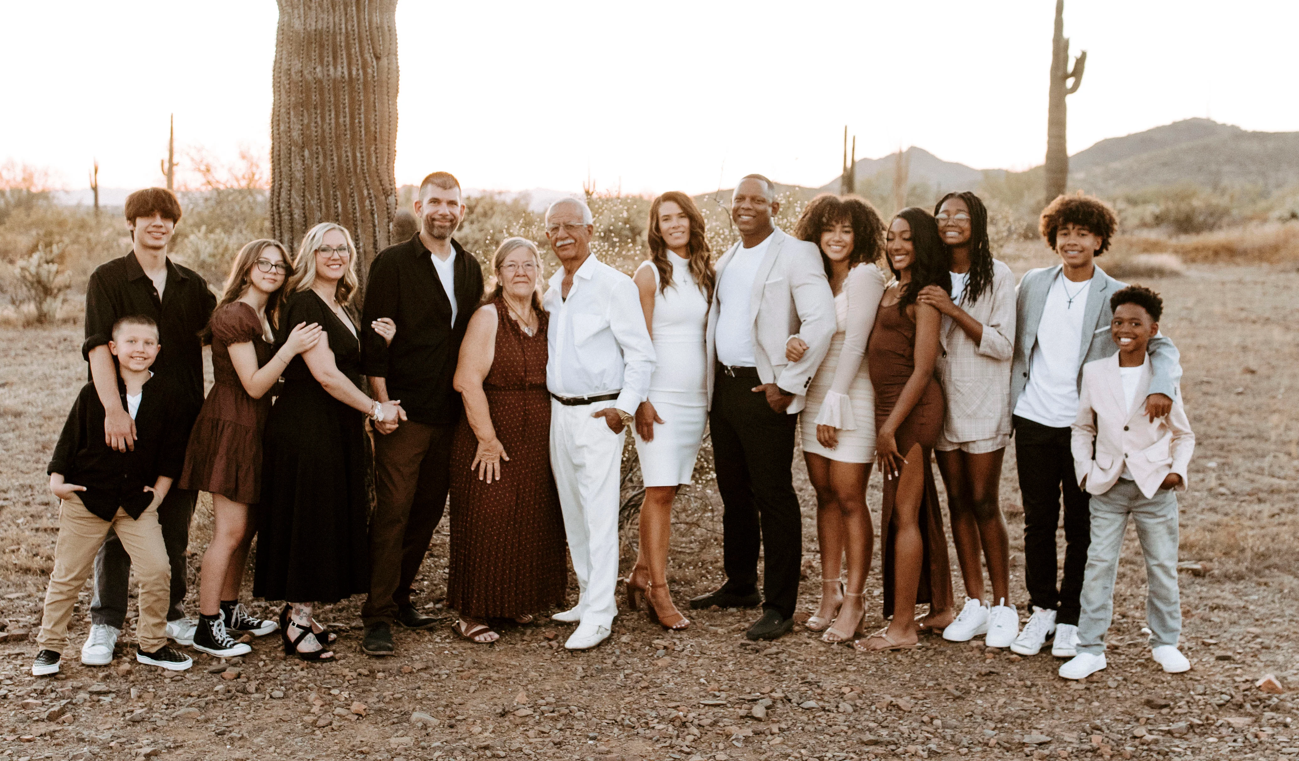 Family portrait in a desert landscape at sunset