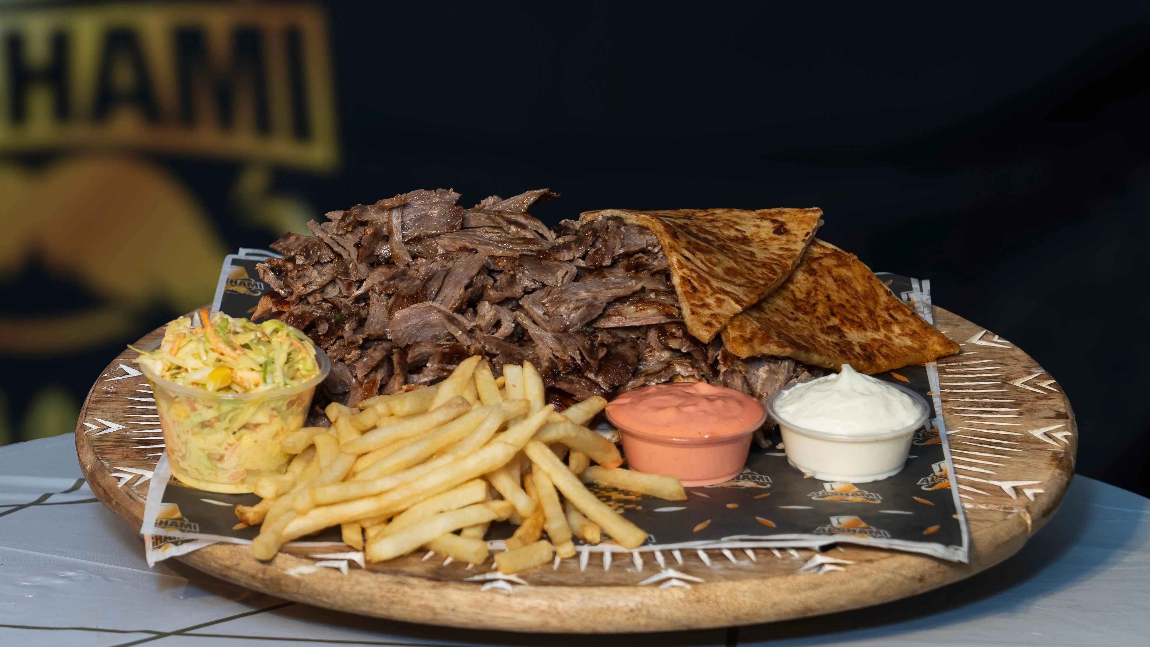 Platter of Mexican carne asada with tortillas and sides