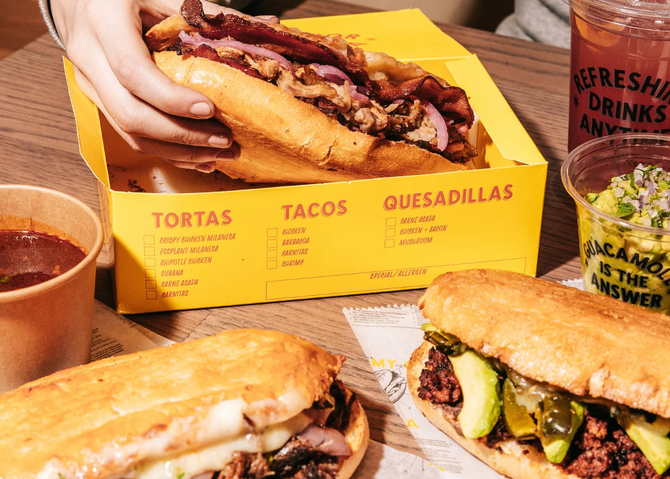 Delicious Mexican tortas served in a vibrant restaurant setting