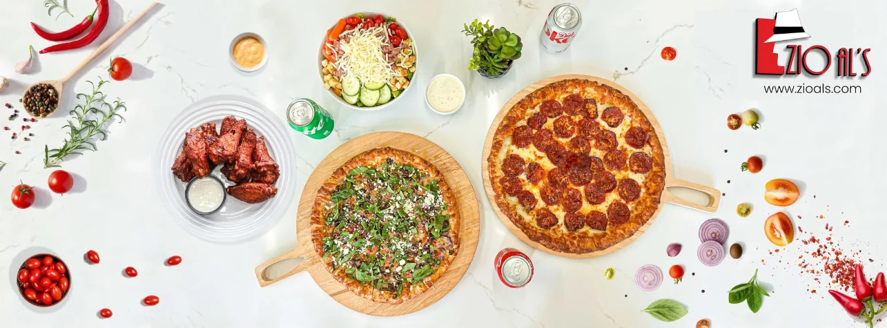 Delicious pepperoni pizza and wings in a vibrant restaurant setting