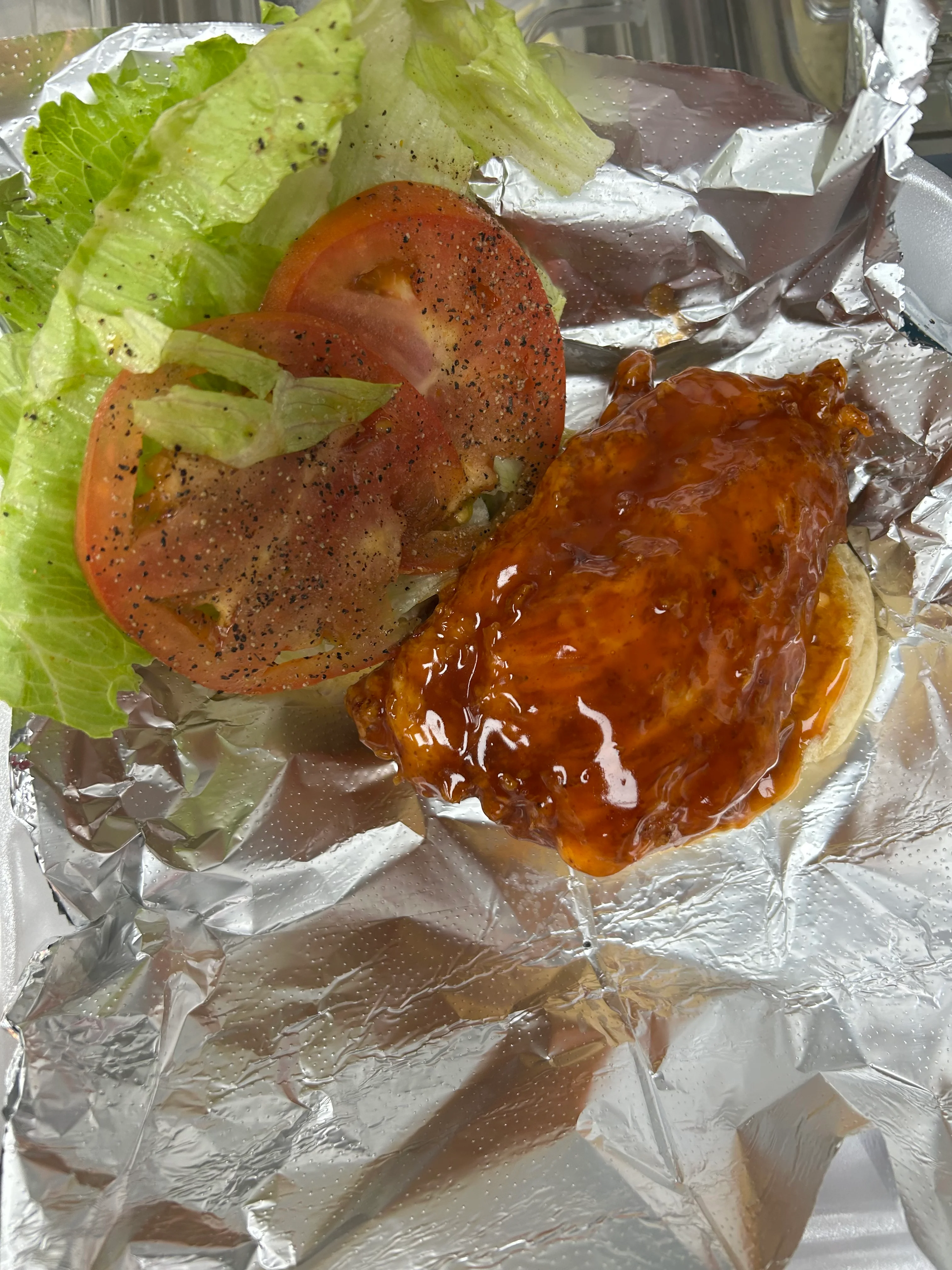 BBQ chicken sandwich with lettuce and tomato
