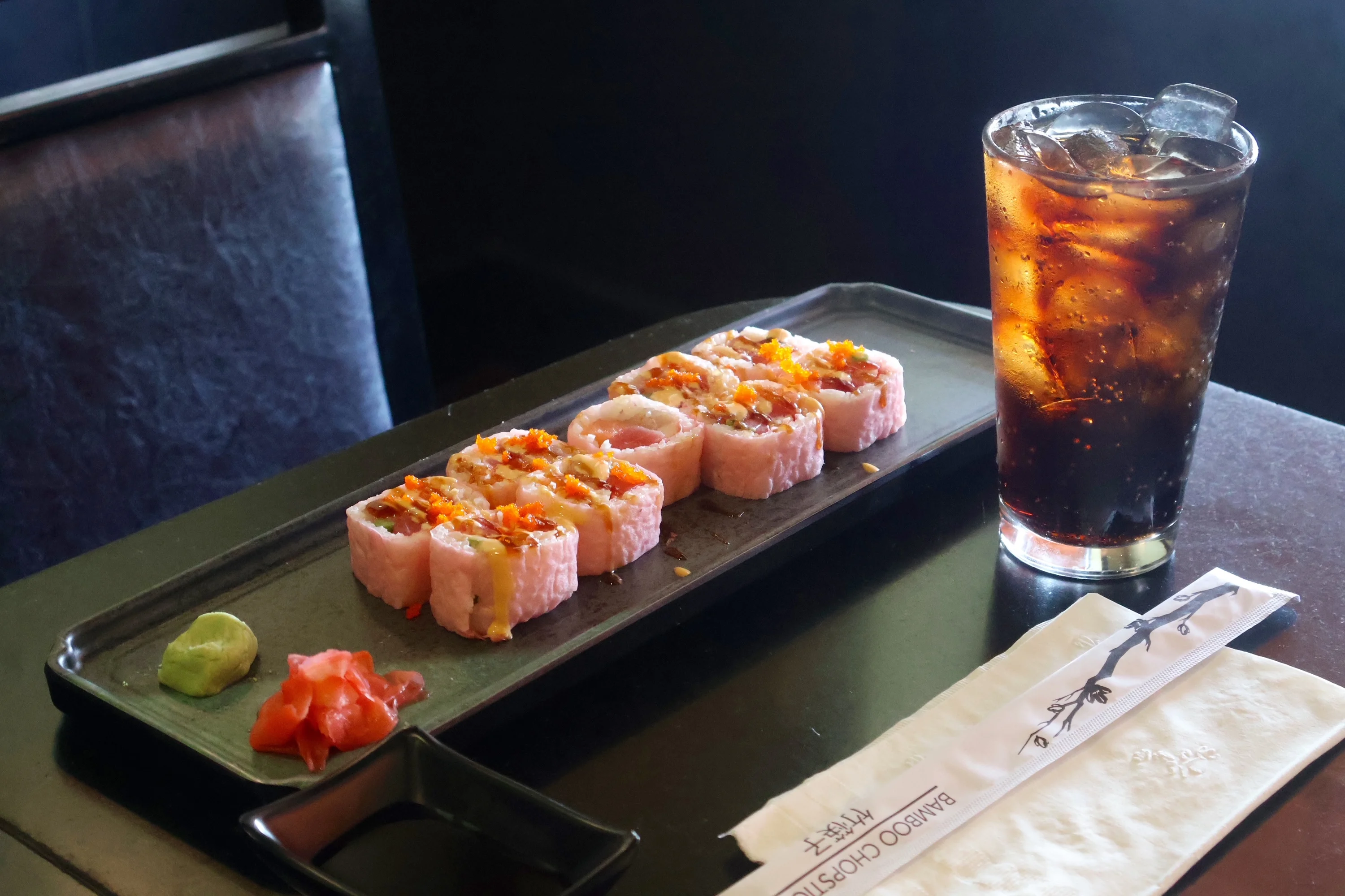 Colorful sushi rolls served with wasabi and pickled ginger