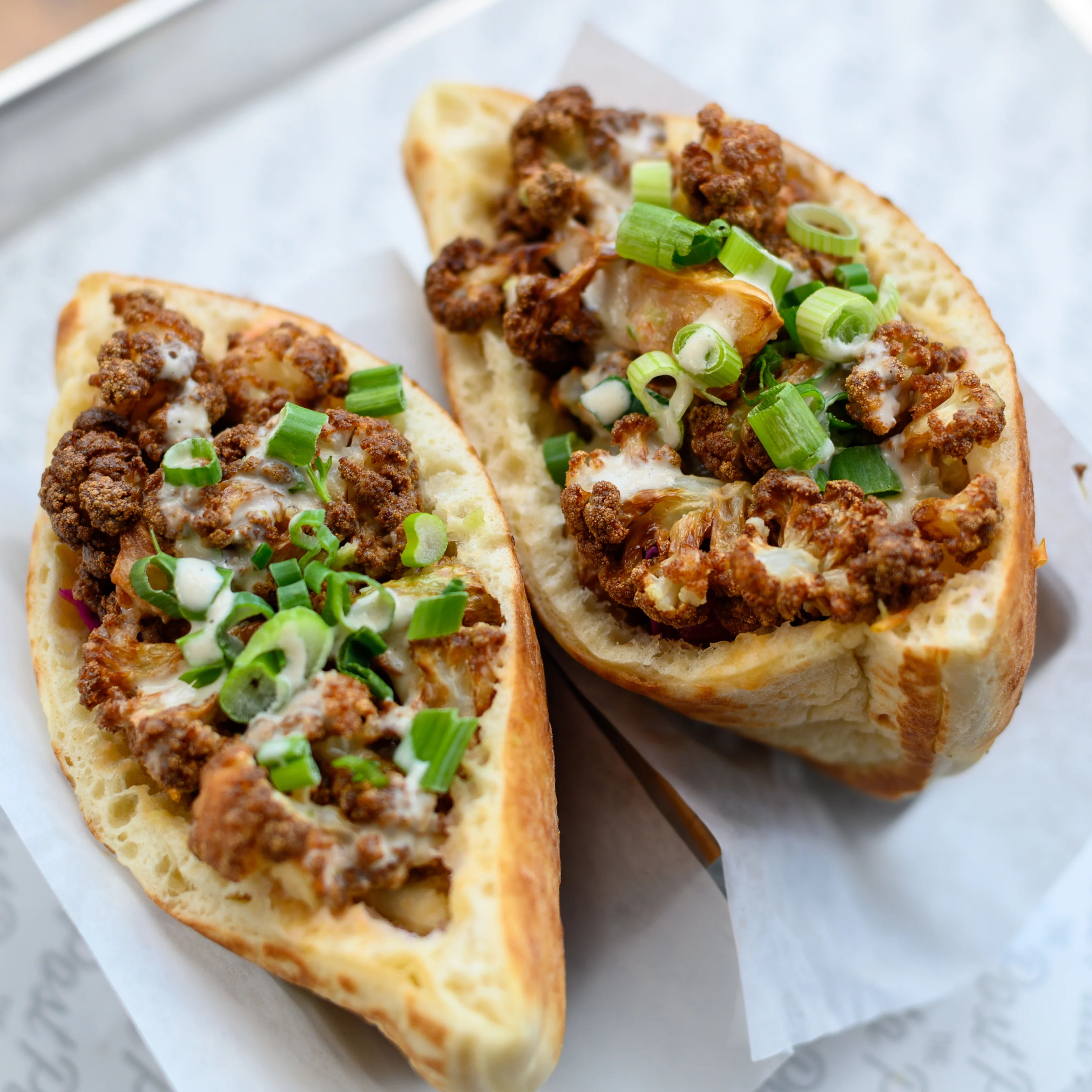 Cauliflower pita bread stuffed with meat, onions, scallions, and other delicious ingredients