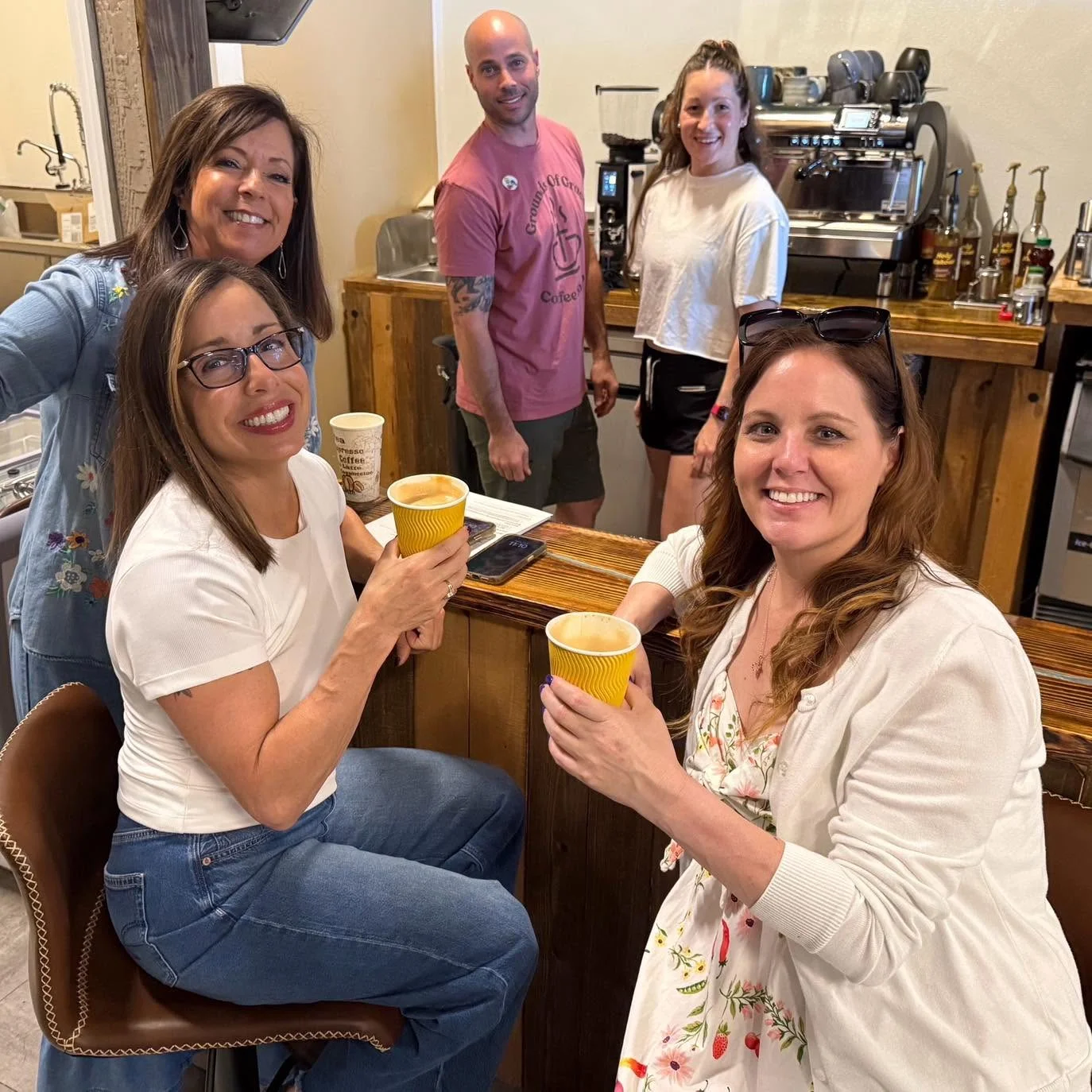 Group of friends enjoying coffee at a cozy café