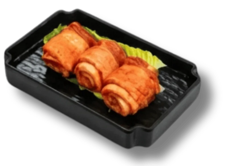 Three rolled sushi pieces on a black plate with green garnish.