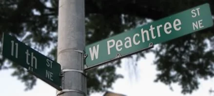 Street sign at the intersection of W Peachtree and 11th St NE