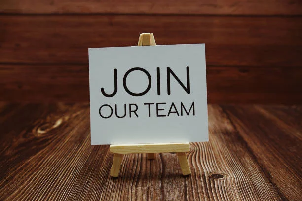 Sign on an easel inviting people to join a team
