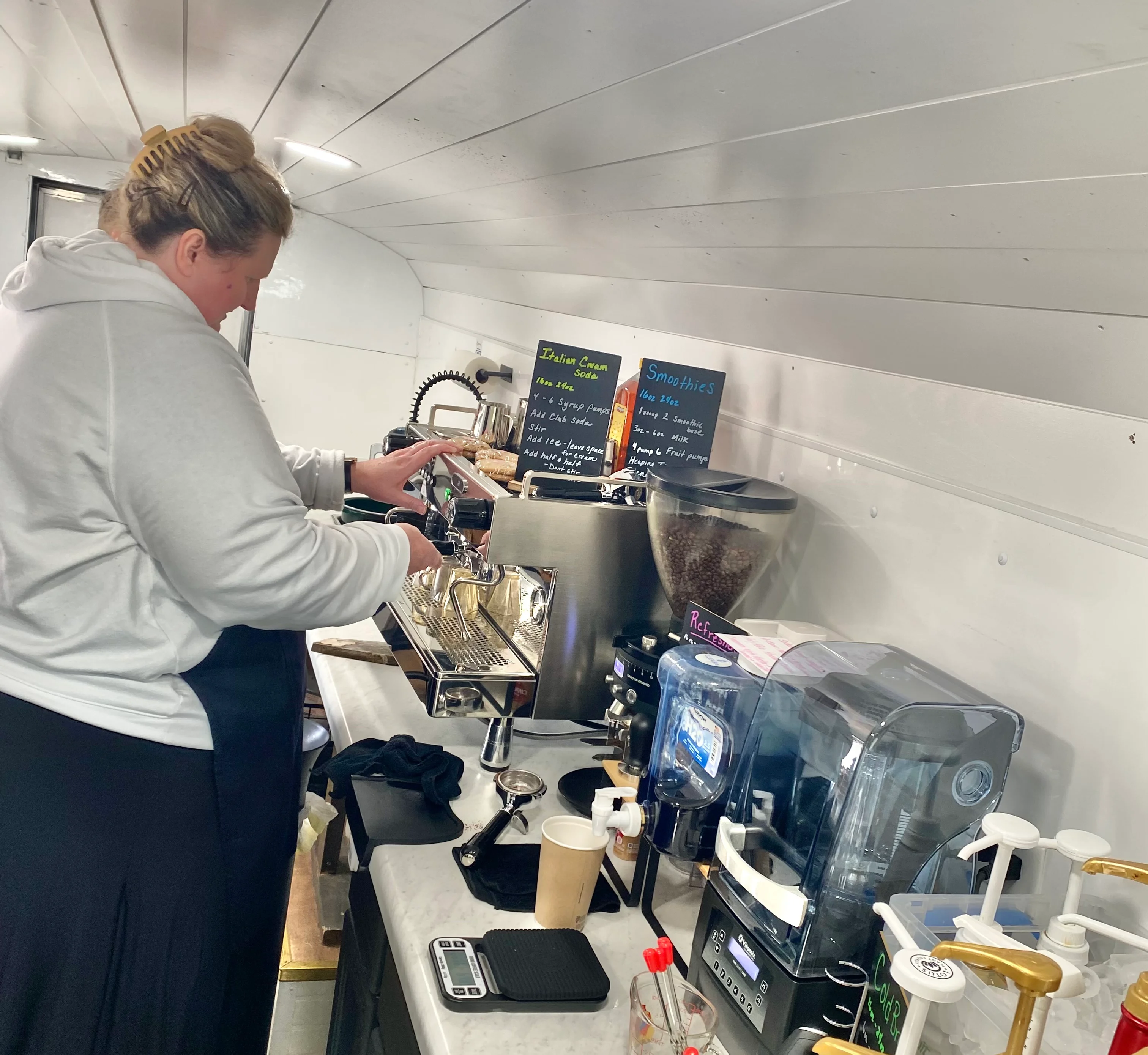 Barista preparing coffee in a mobile café