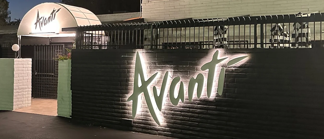 Entrance of Avanti restaurant illuminated at night