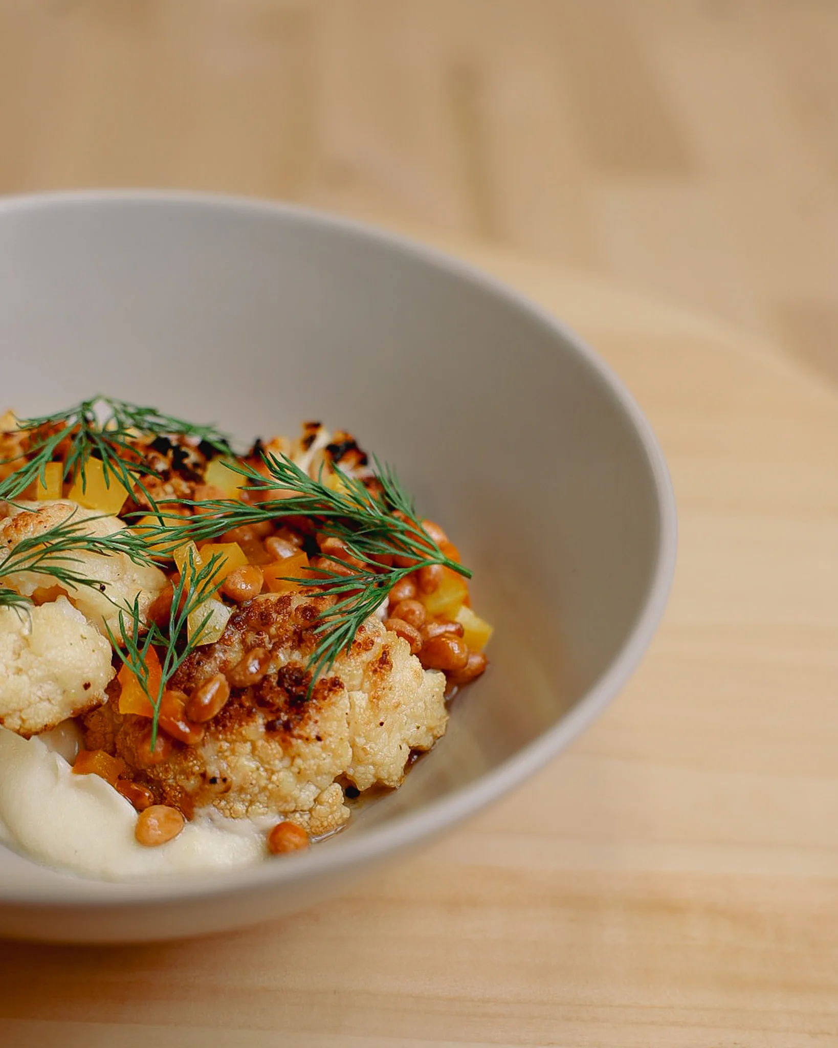 Roasted cauliflower dish with dill and pine nuts