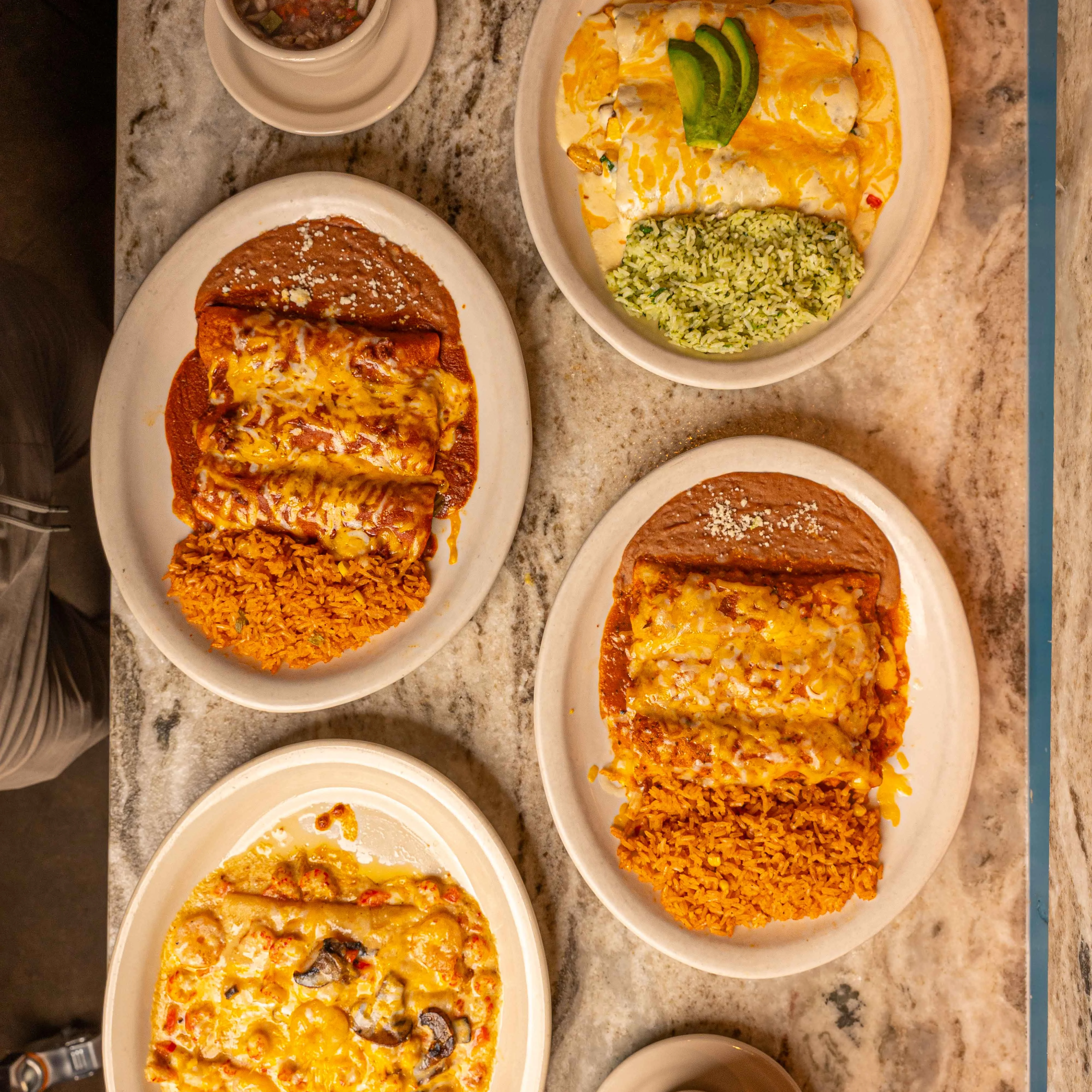 Delicious Mexican enchiladas with rice and beans