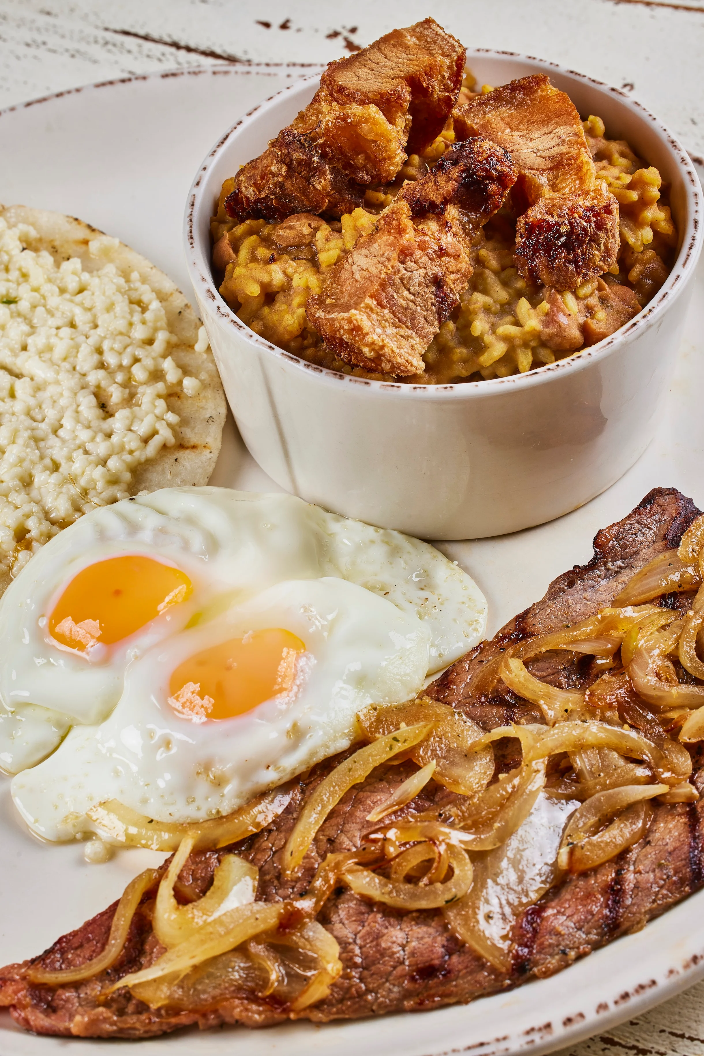 Traditional Honduran plato tĂpico with eggs and beef