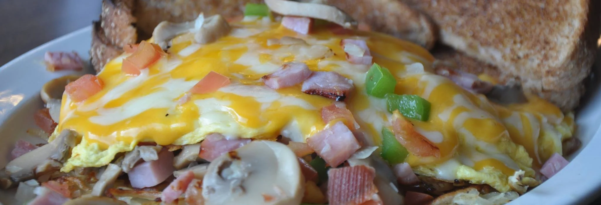 Hearty American omelette with cheese and vegetables