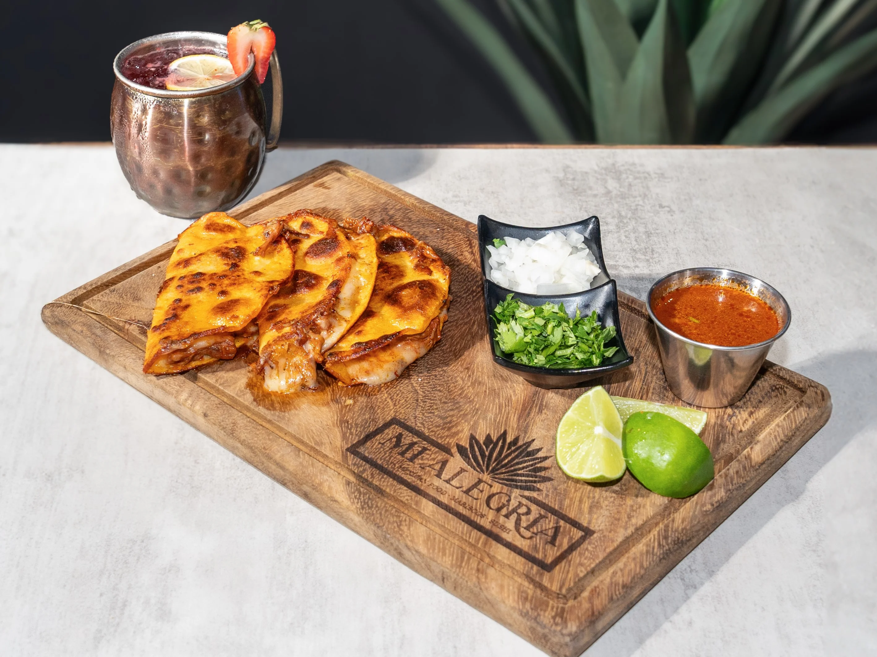 Delicious Mexican quesadillas served with salsa and lime