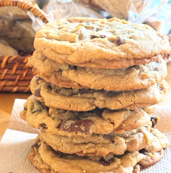 Freshly baked chocolate chip cookies stacked high
