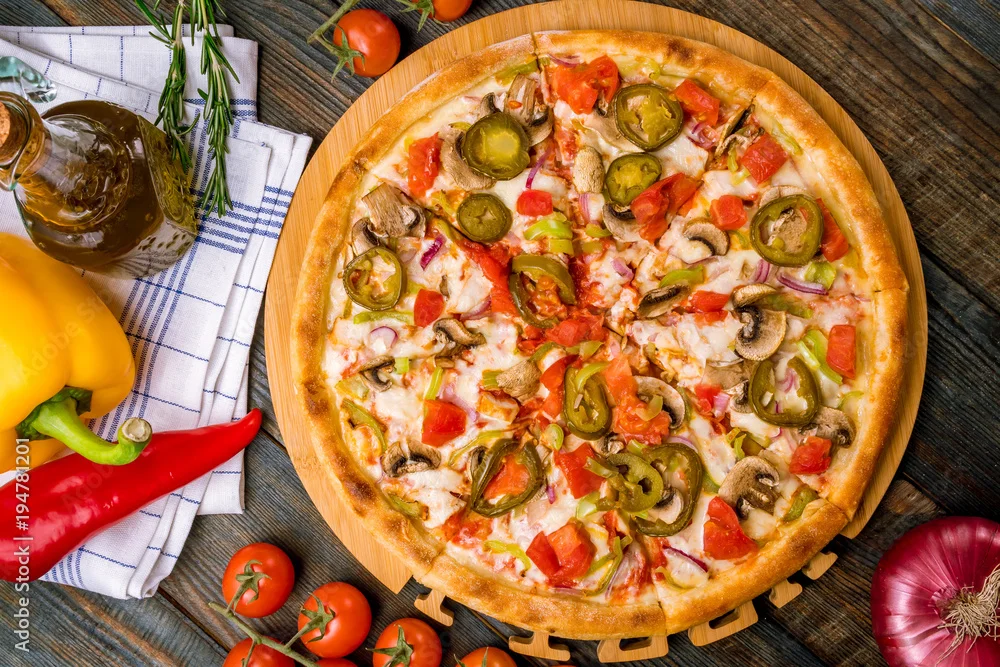 Vegetarian pizza topped with fresh vegetables