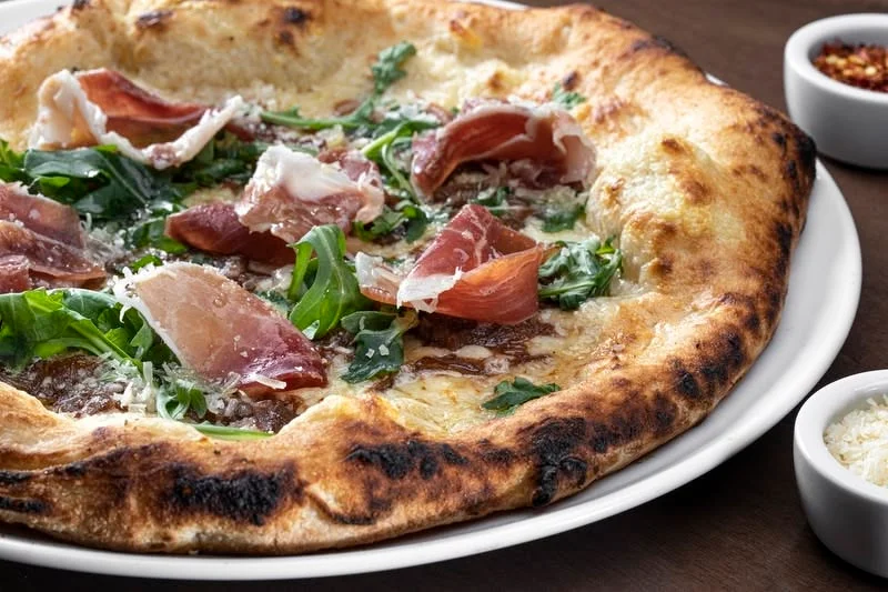 Italian prosciutto pizza with arugula