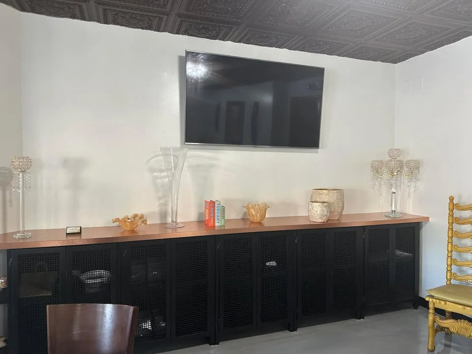 Elegant restaurant interior with decorative accents and a TV