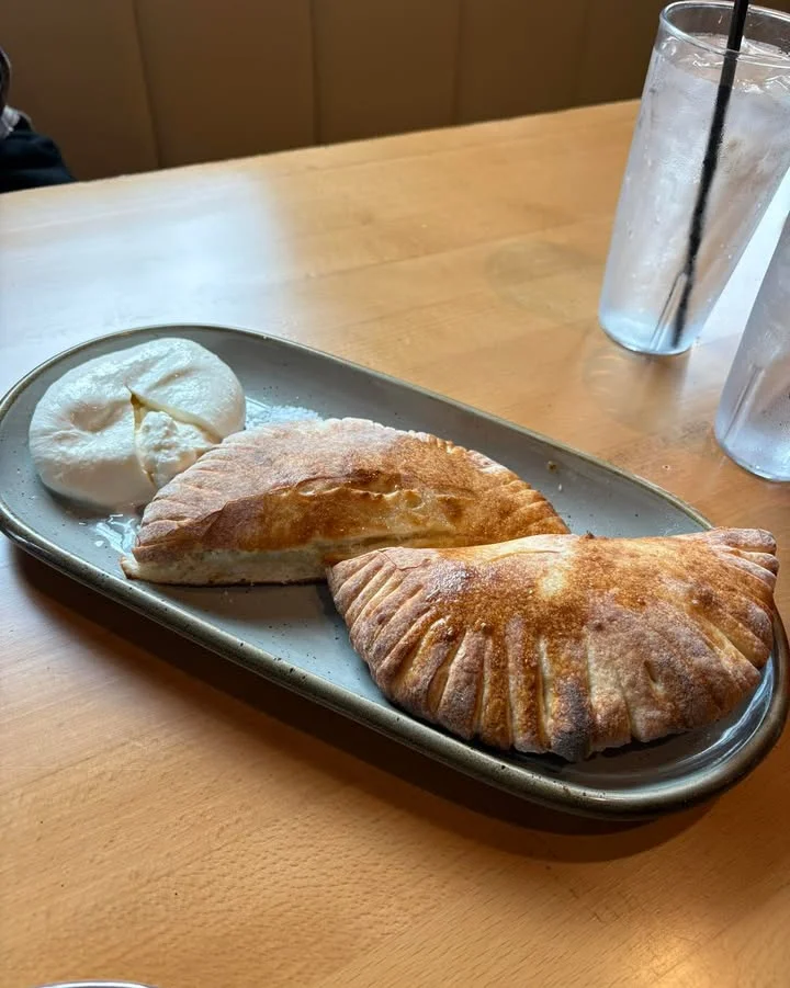 Savory Chinese bao and baked pastries on a plate
