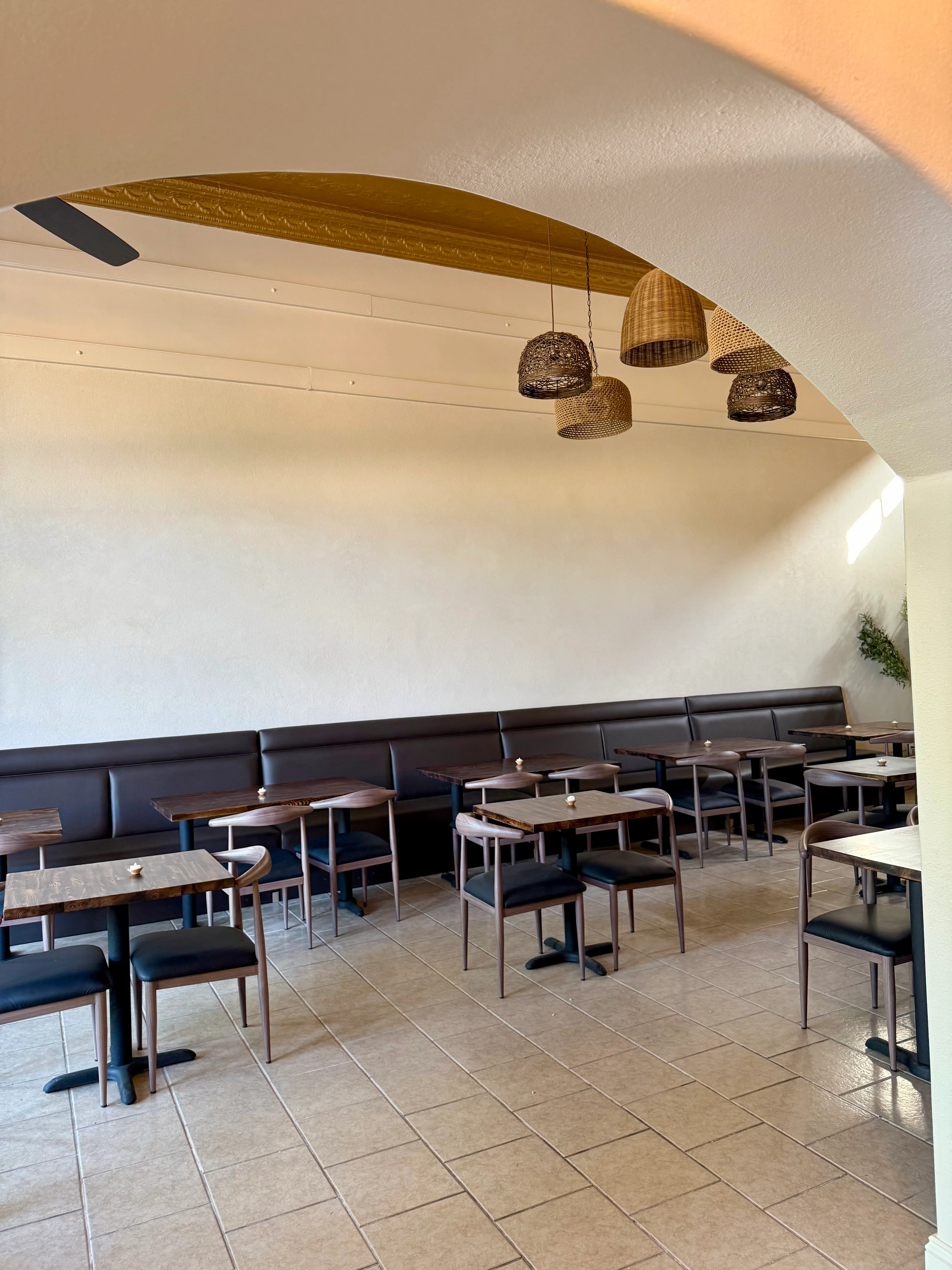 Modern restaurant interior with stylish seating and pendant lighting
