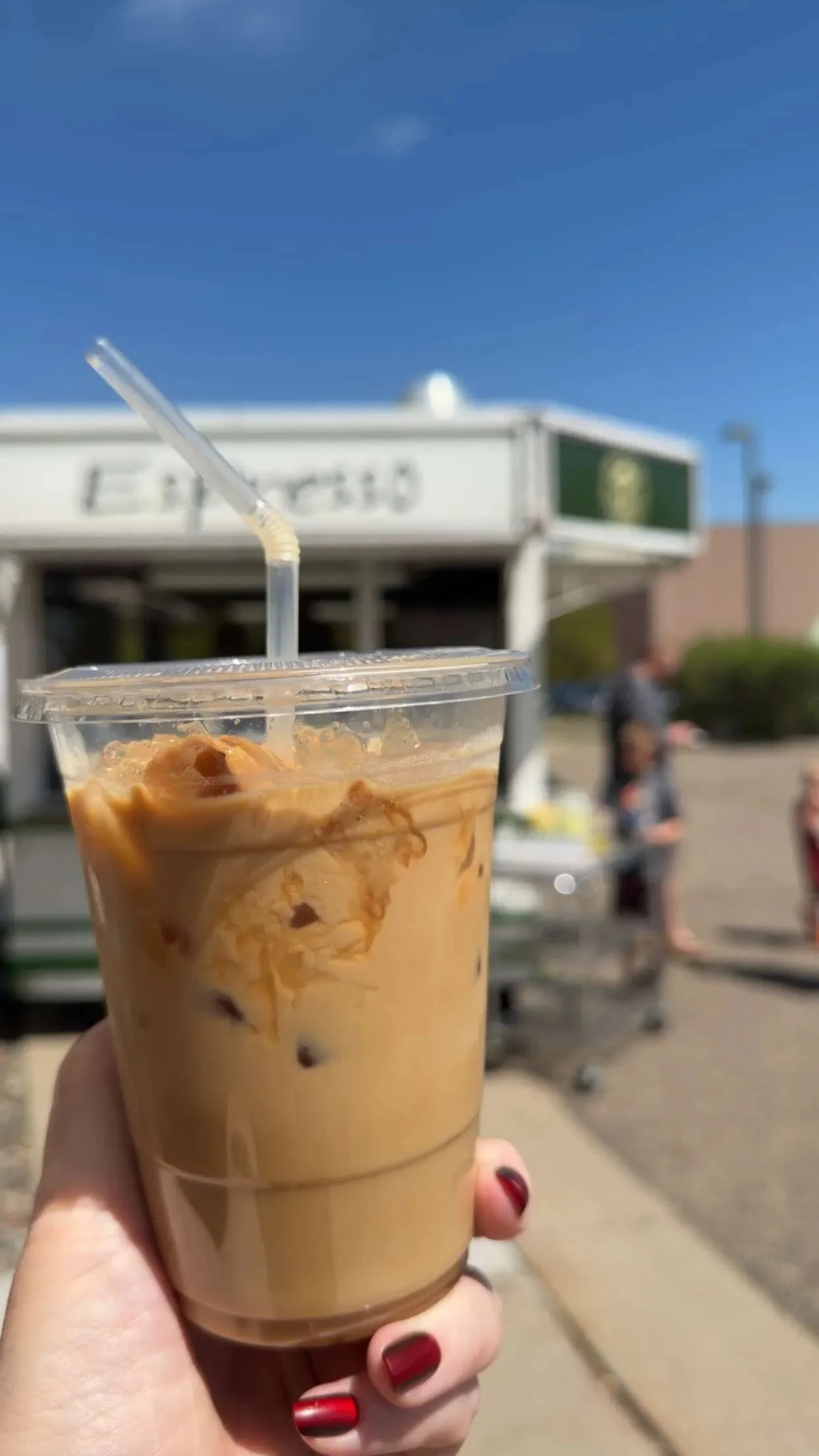 Iced coffee drink from a food truck on a sunny day