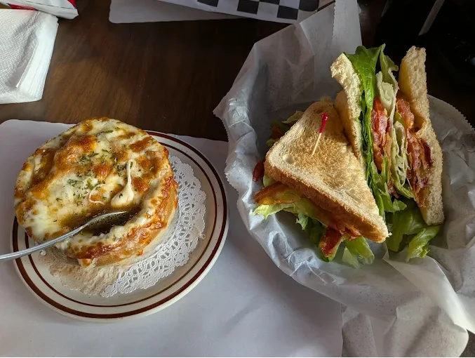 Classic club sandwich with crispy bacon and cheesy lasagna