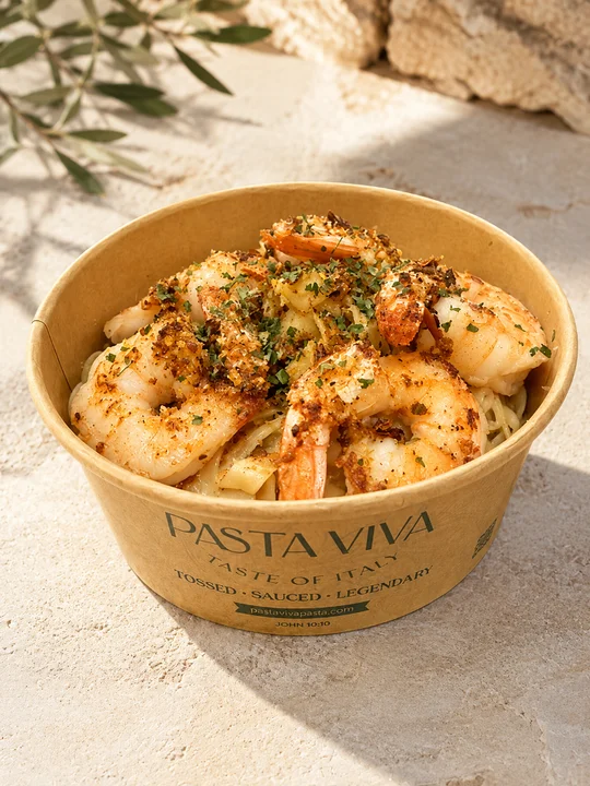 Shrimp linguine in a takeout bowl from an Italian restaurant