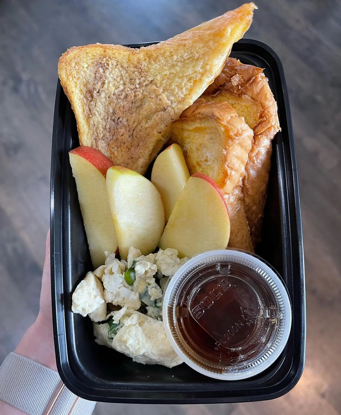 Breakfast platter with French toast and scrambled eggs
