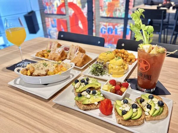 Brunch spread featuring avocado toast and cocktails