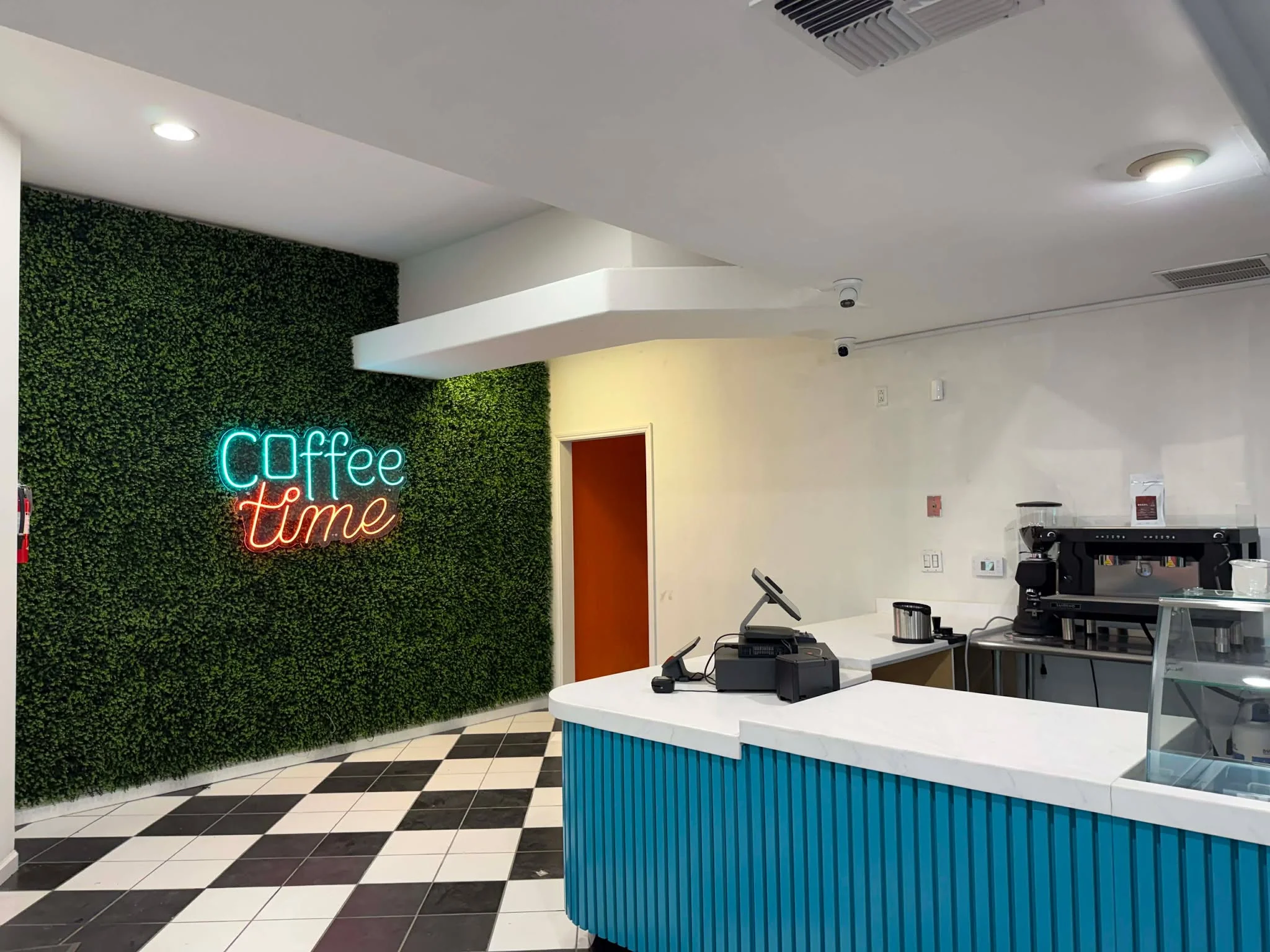 Modern coffee shop interior with neon sign
