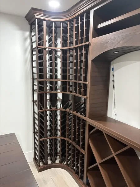 Elegant wooden wine rack with curved design and storage compartments