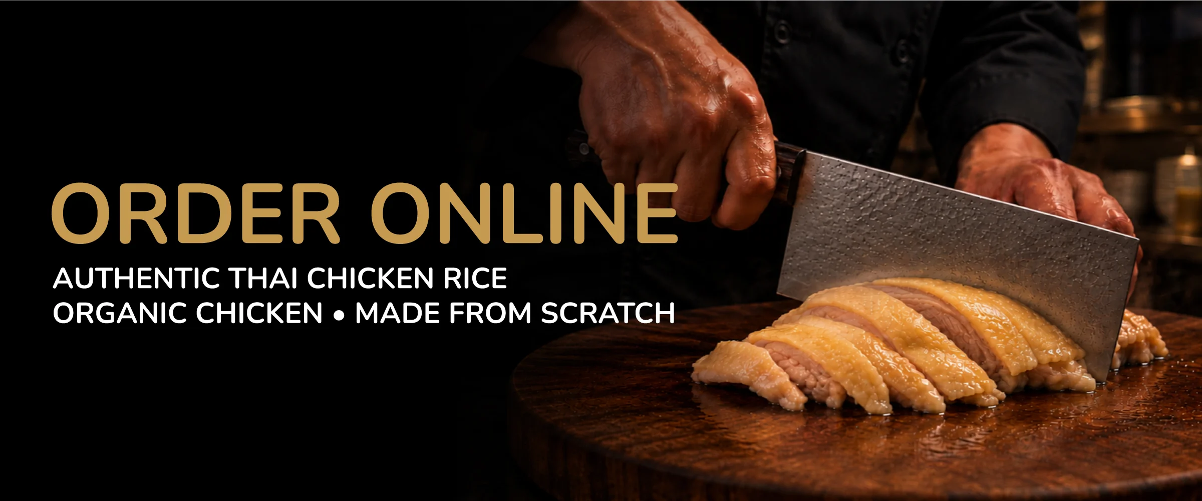 Sliced Thai chicken rice on a wooden board, showcasing authentic preparation