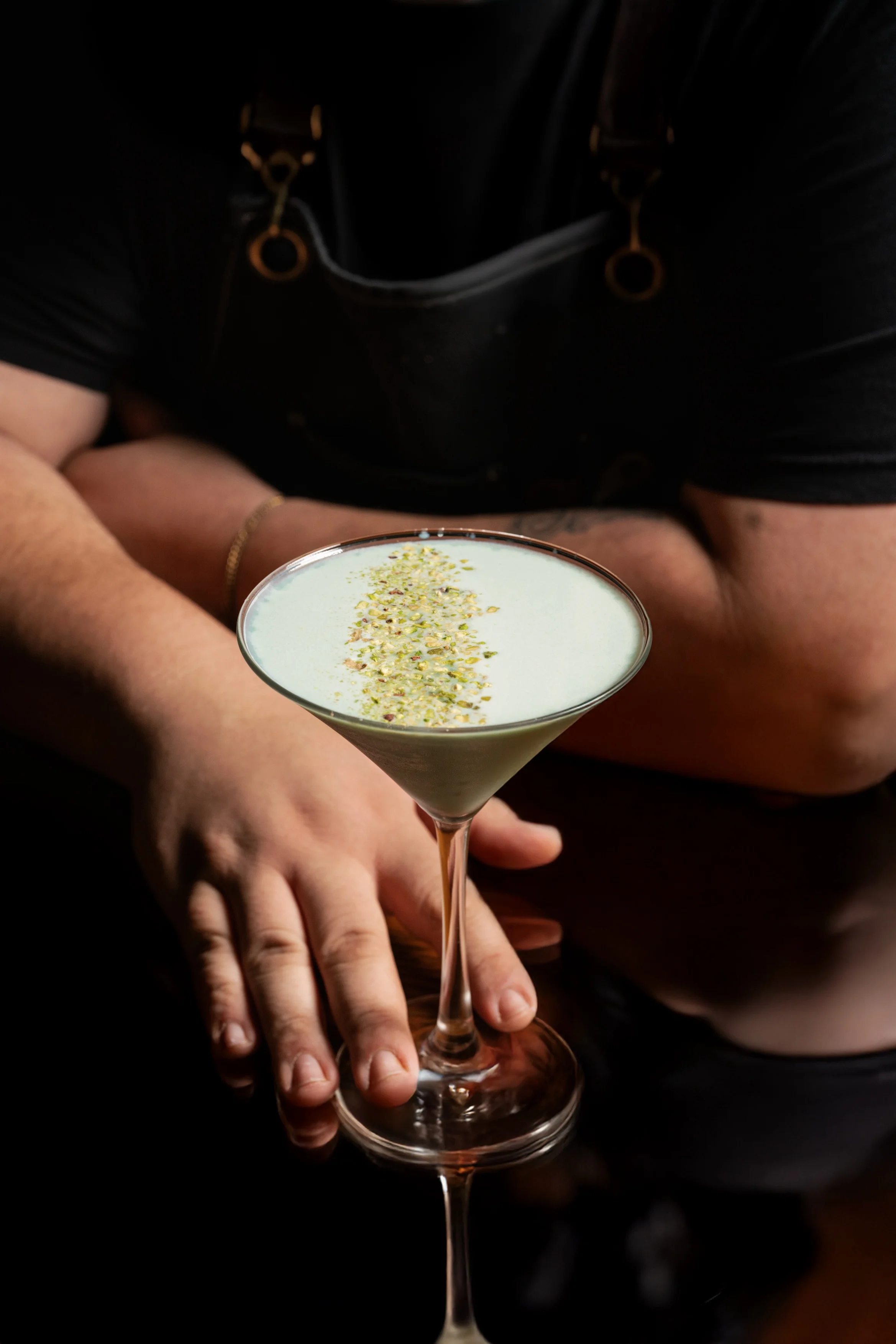 Crafted cocktail with floral garnish at a modern bar