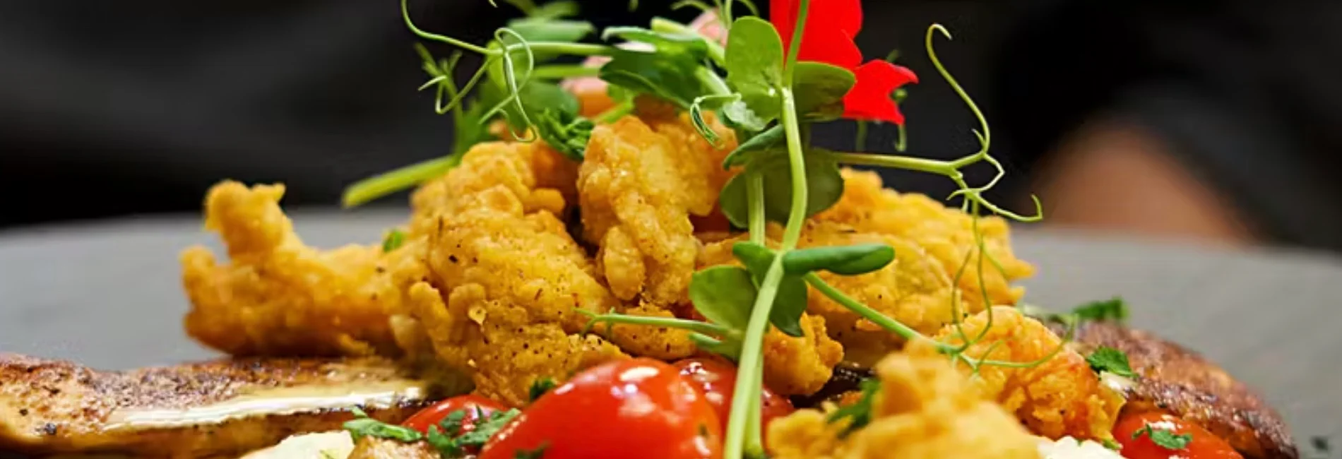 Southern fried catfish with fresh herbs and tomatoes