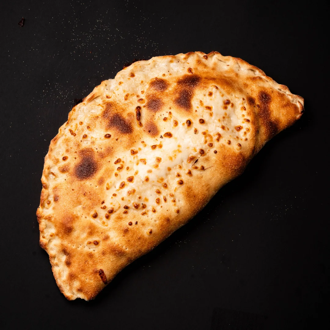 Golden-brown calzone with a crispy crust