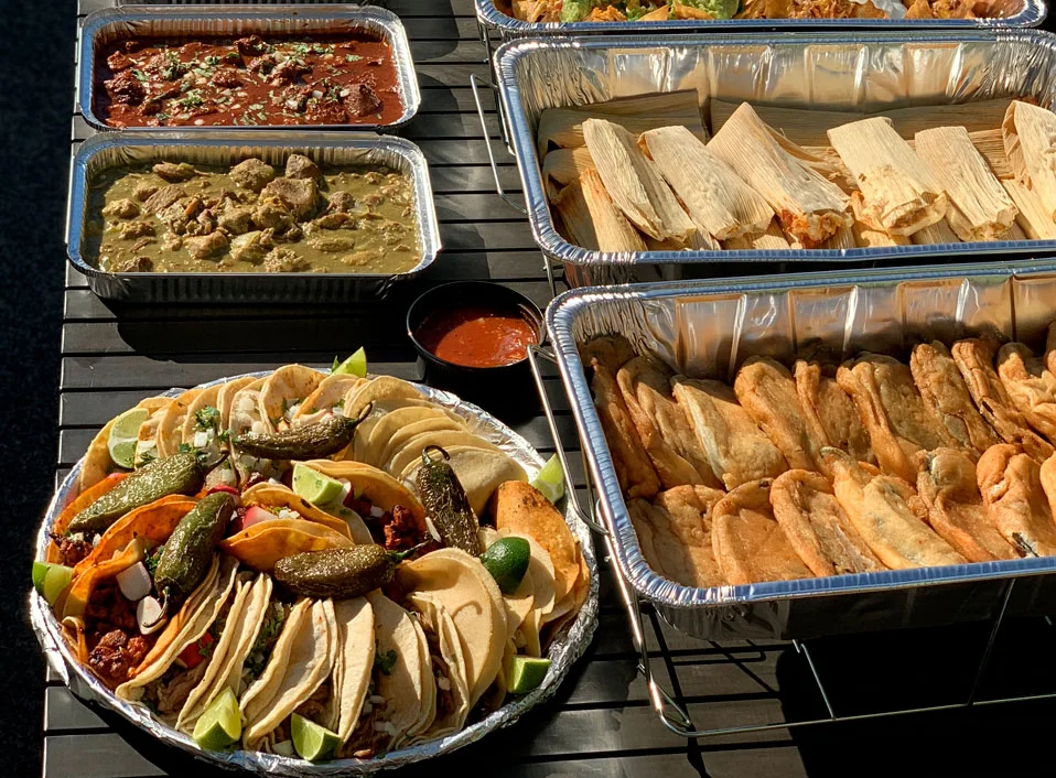 Assorted Mexican feast with tacos, enchiladas, and rice