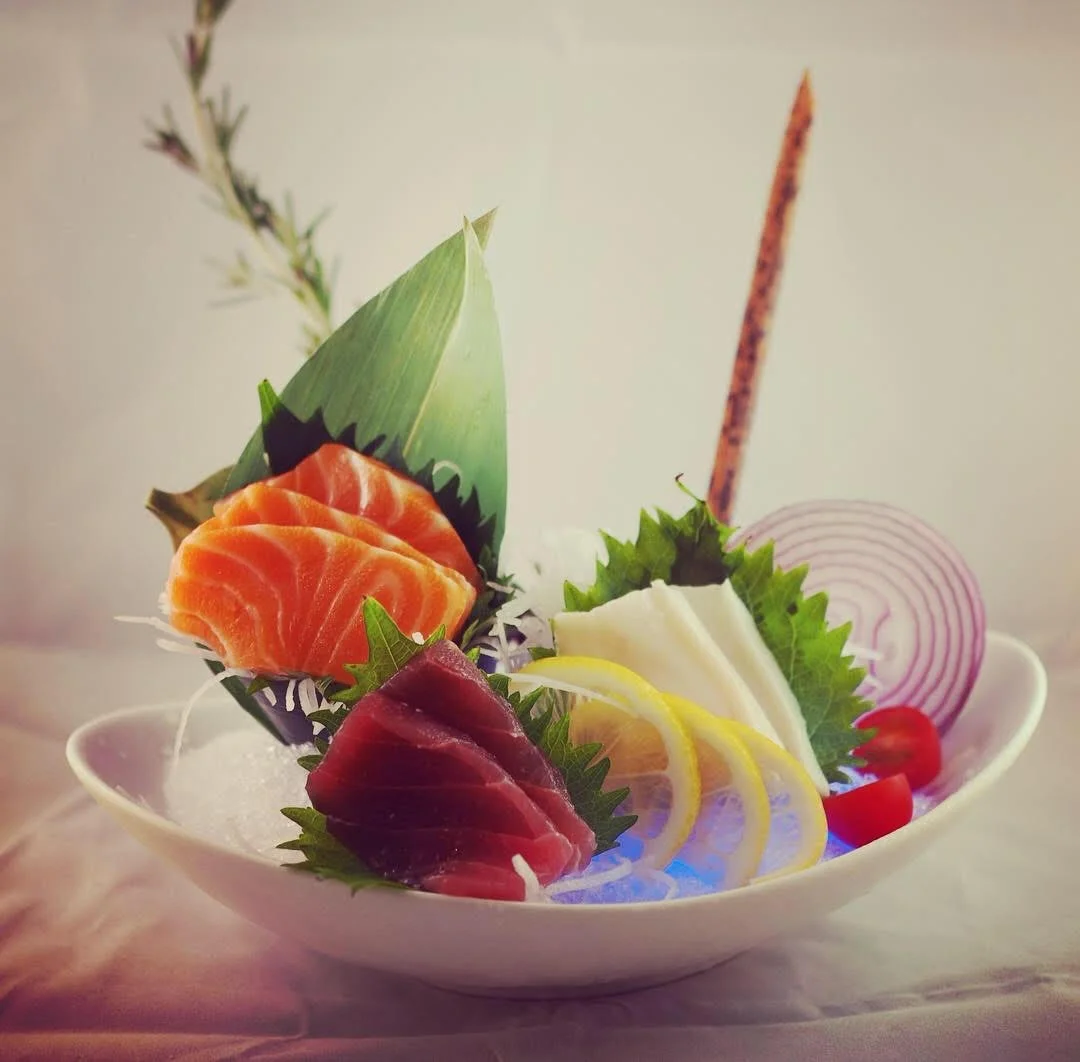Japanese sashimi platter with assorted fish and garnishes
