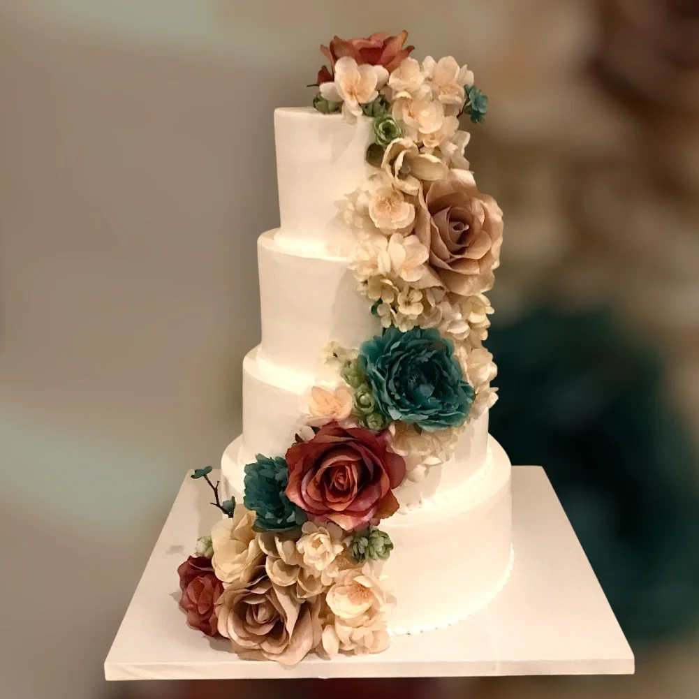 Elegant wedding cake adorned with floral decorations