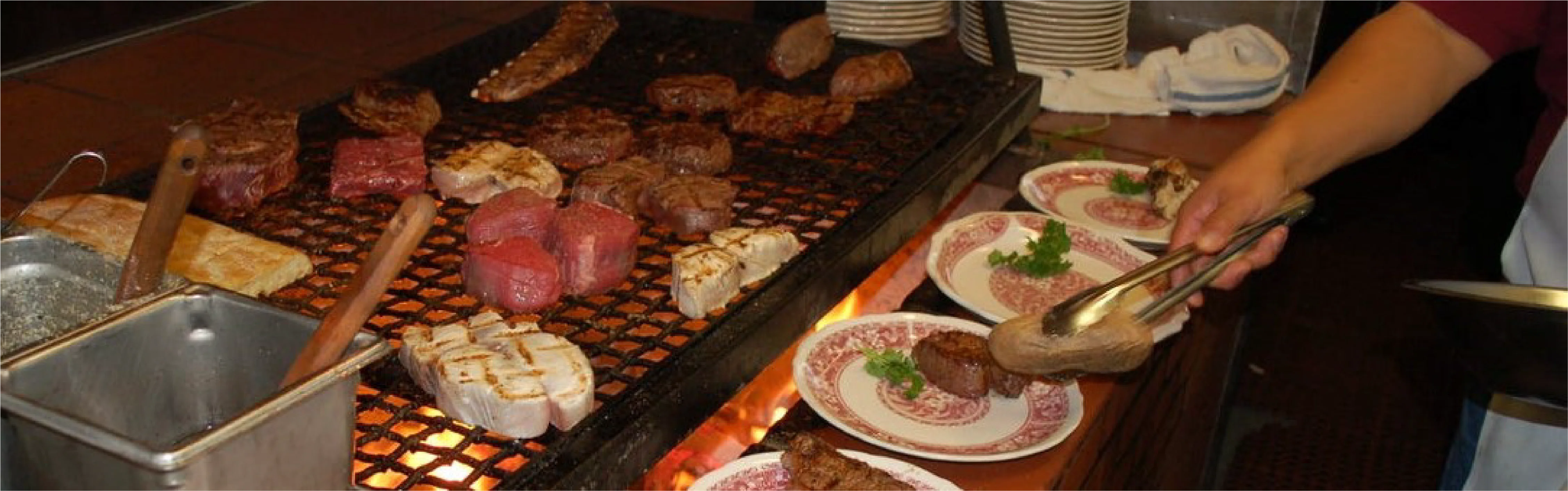 Grilled Argentine asado with various meats on a barbecue