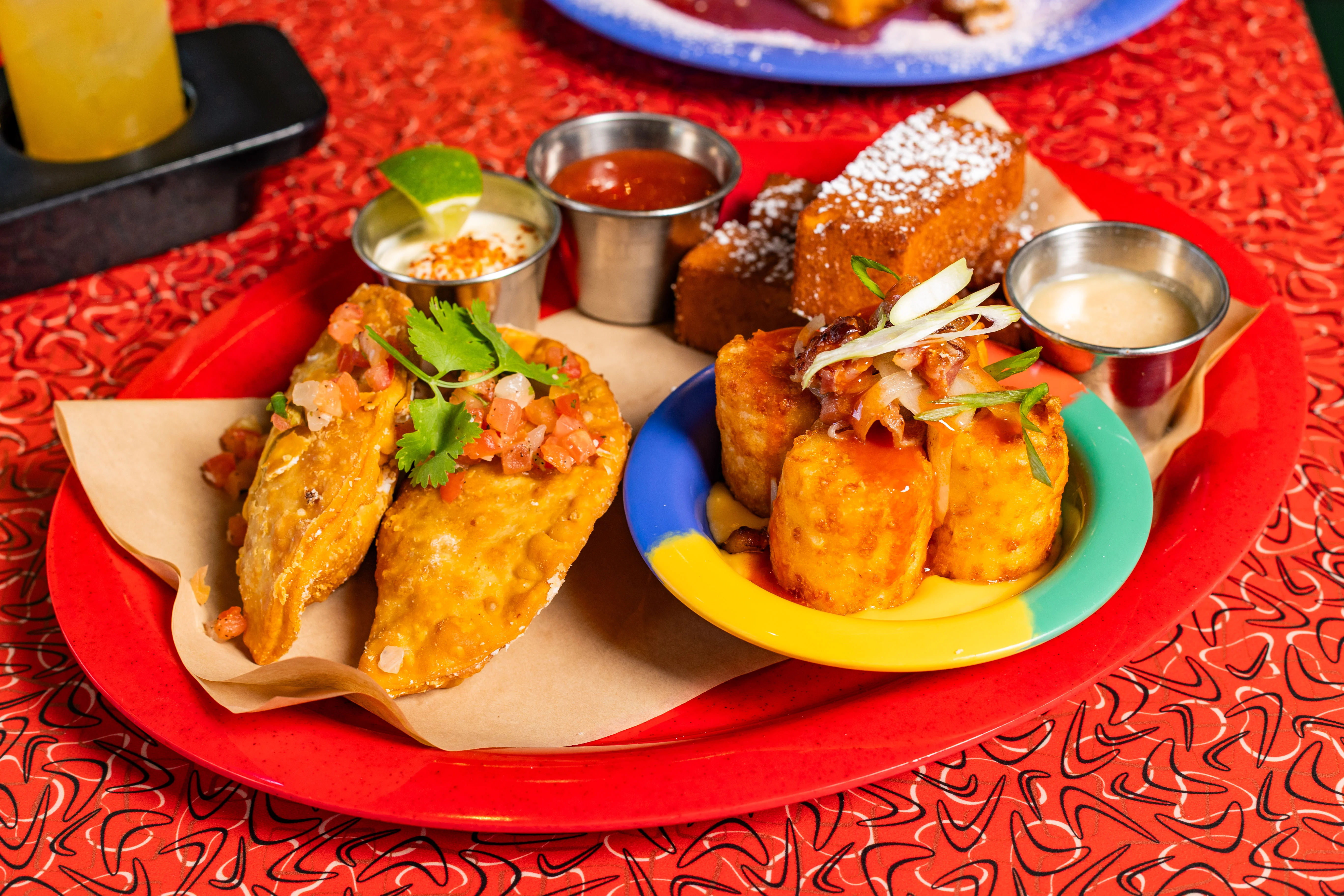 Crispy Mexican empanadas with toppings and sides
